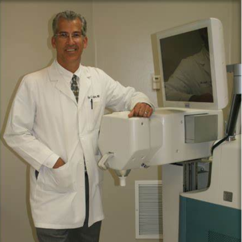 Dr. Balch Photo, standing next to a medical device